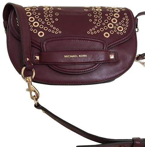 michael michael kors cary medium leather saddle bag|michael kors burgundy crossbody bag.